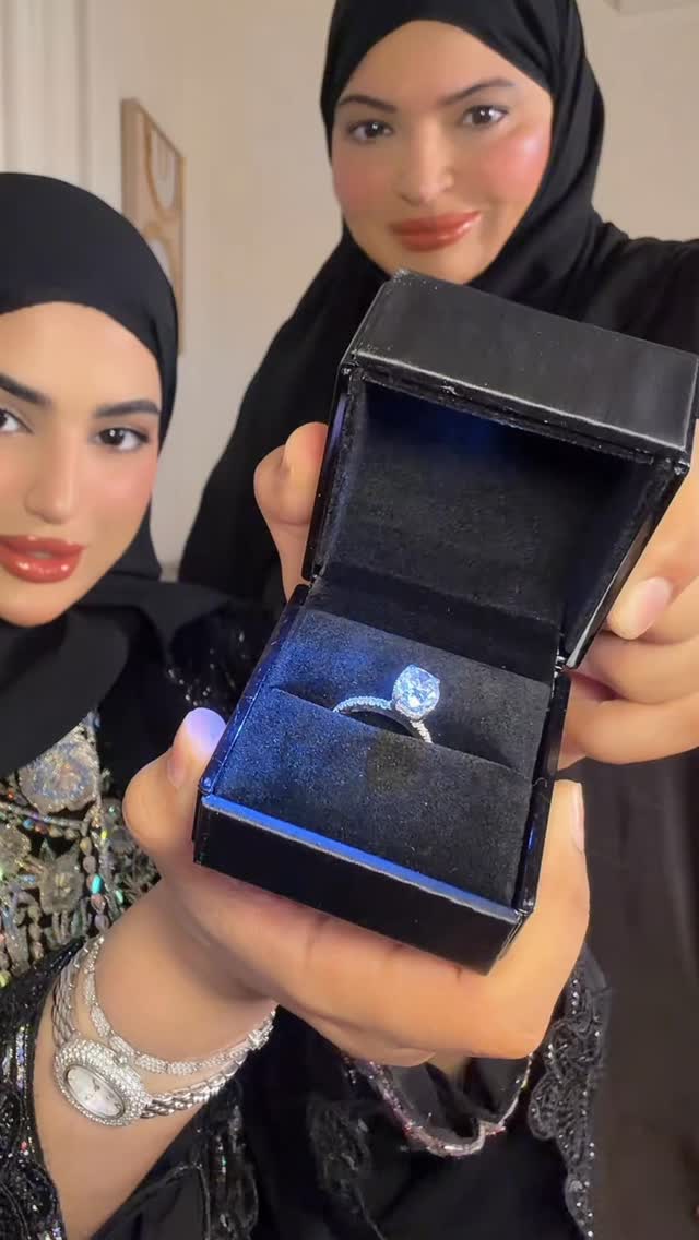 Almas pear-cut moissanite ring presentation